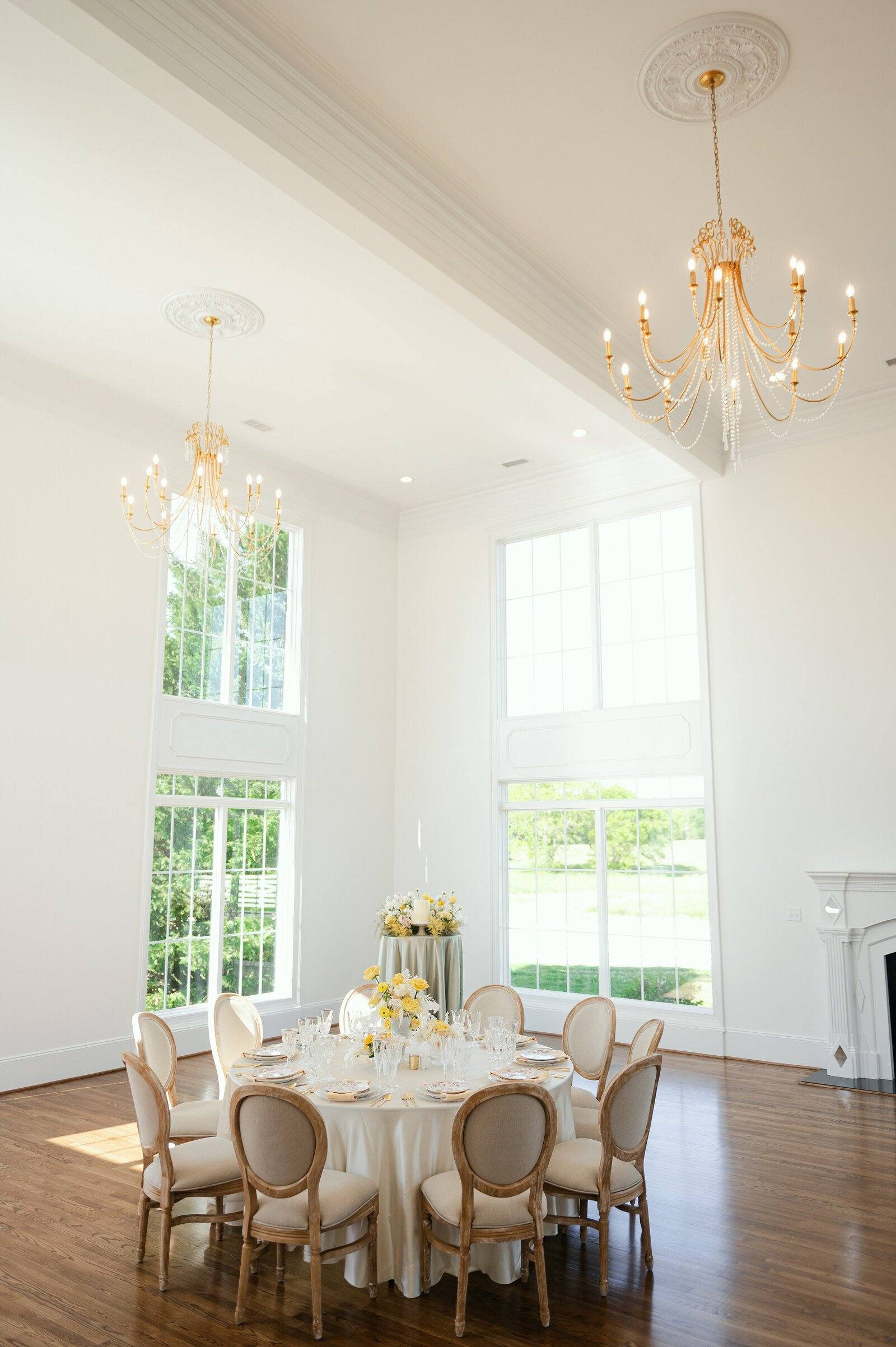 Crystal chandeliers and tall windows in the Northfield Estate ballroom