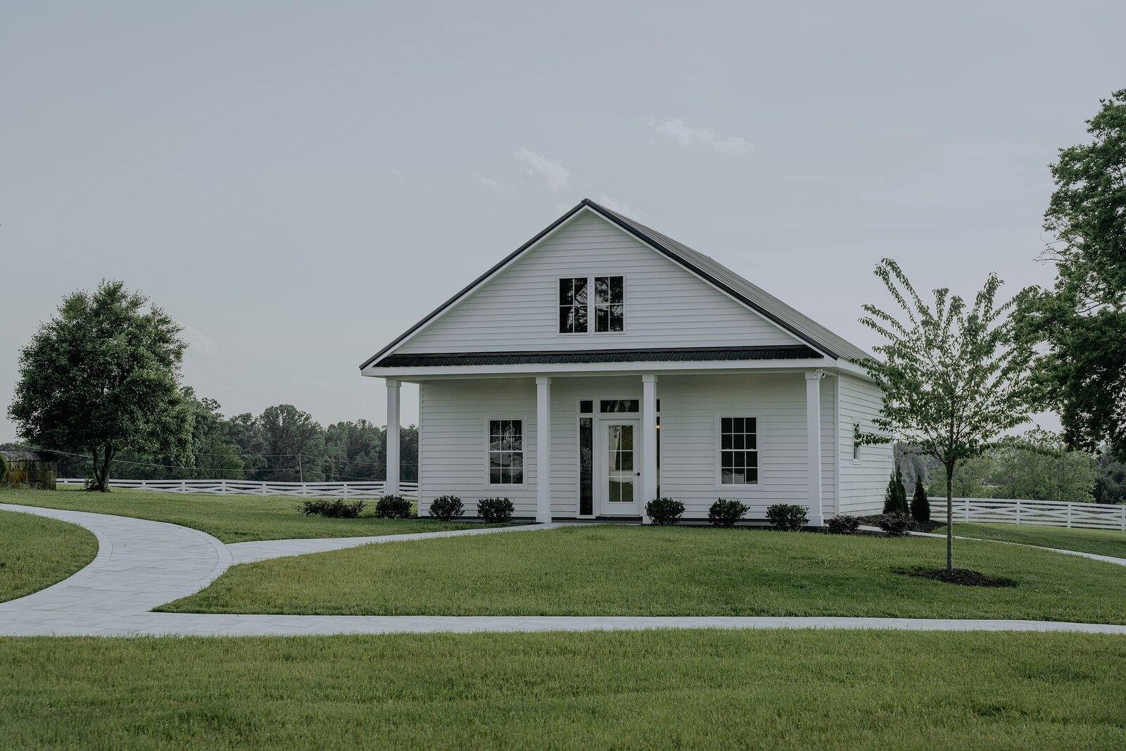 The white groom's cottage on the lawn
