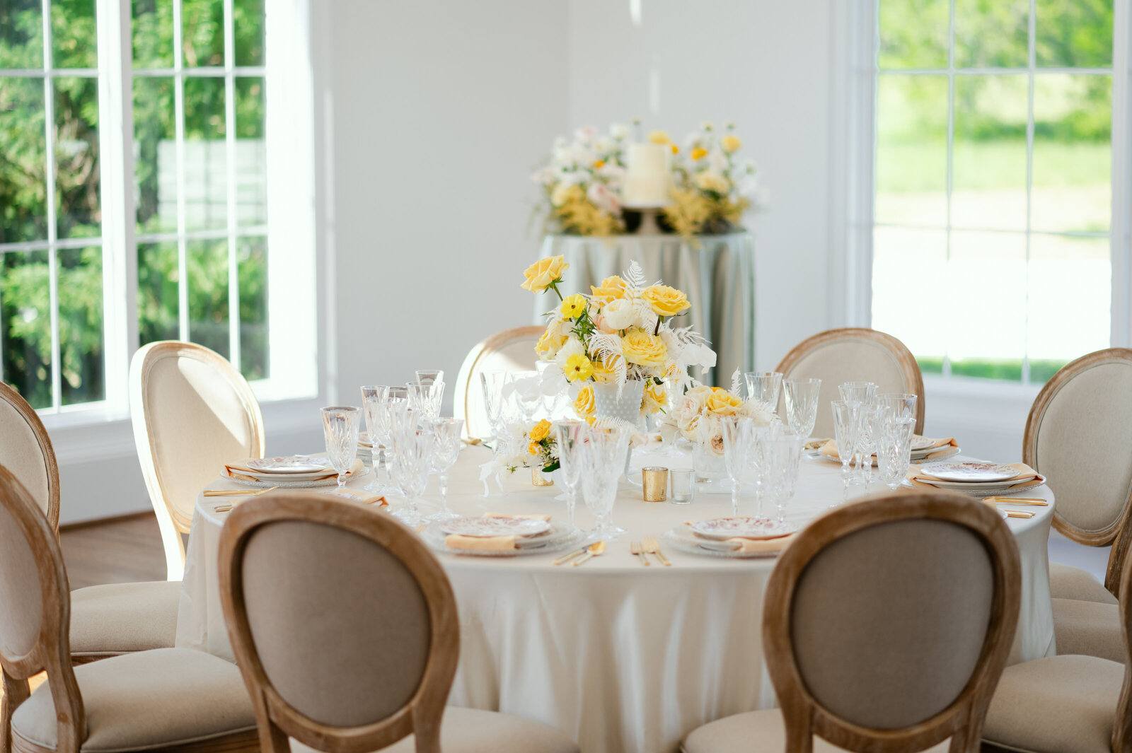 Round tables set with florals in the ballroom