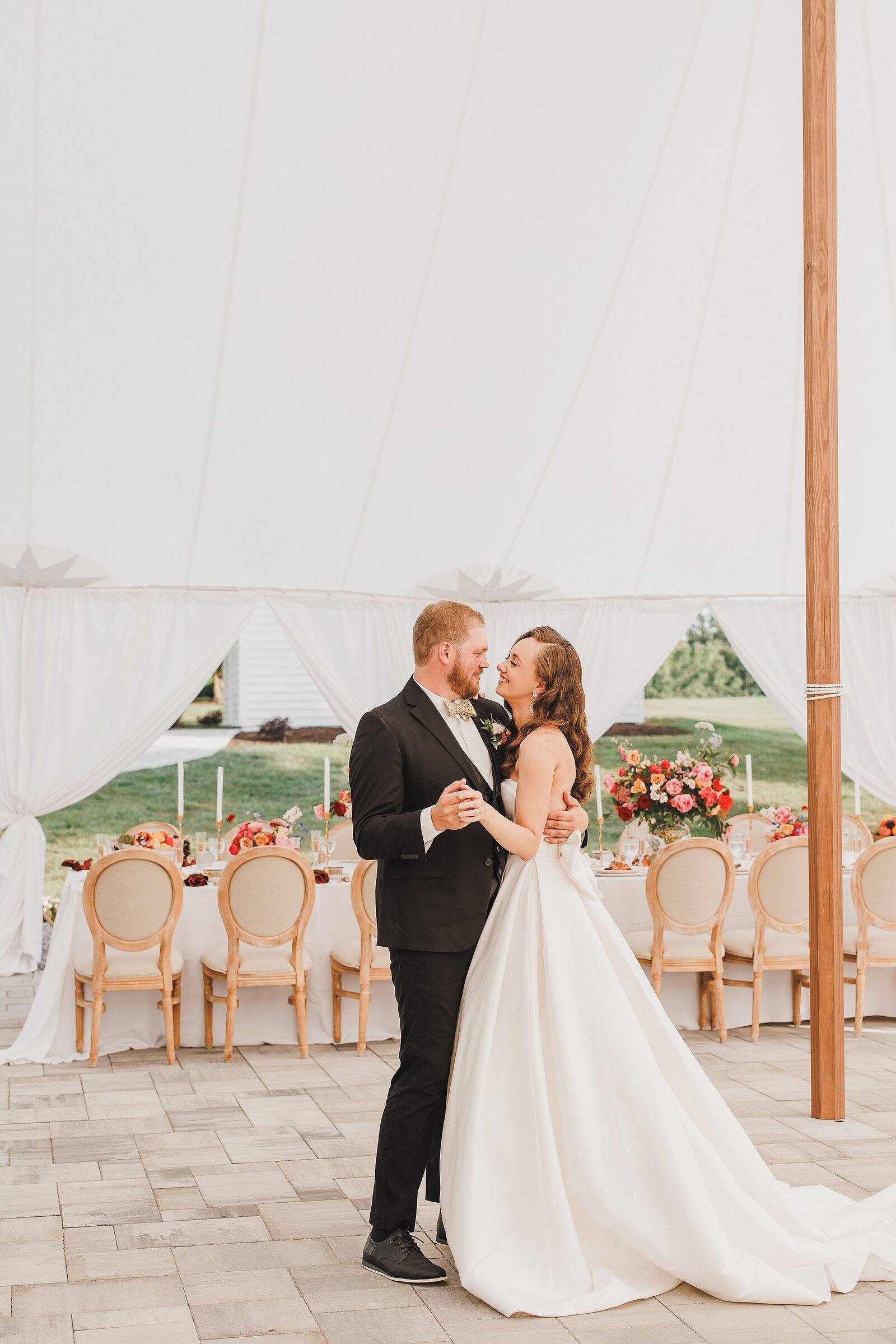 Couple dancing under the sailcloth tent
